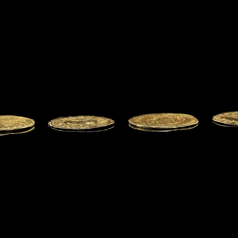 Group of four gold coins