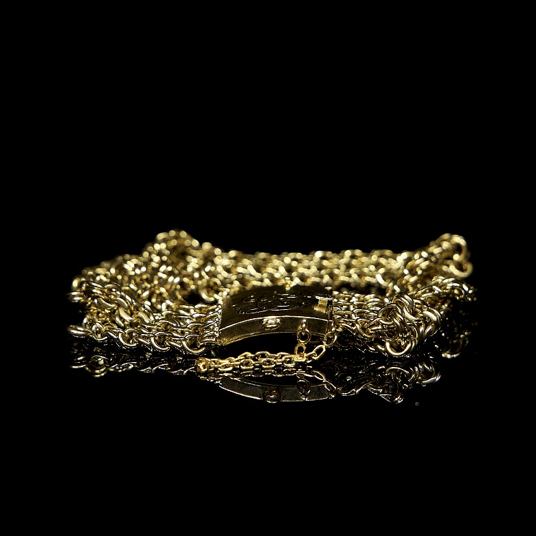 Bracelet with four chains in yellow gold