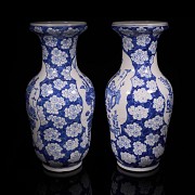 Pair of blue and white ‘Scenes and Plum Blossom’ vases, Qing Dynasty