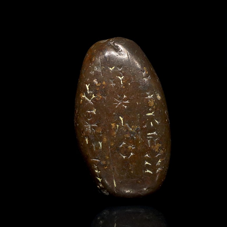 A small amulet with inscriptions, Sumerian or Assyrian.