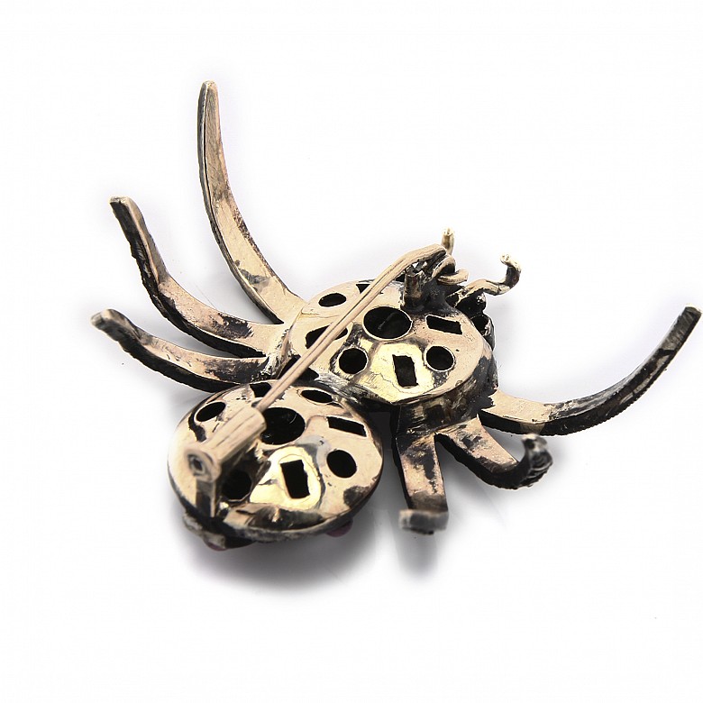 Silver brooch in the shape of a spider.