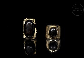 Two rings in yellow gold and black stones