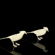 Pair of carved ivory birds, early 20th century.