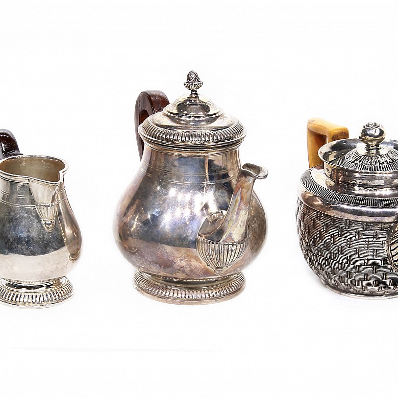 Group of three punched silver teapots, pps.s.XX