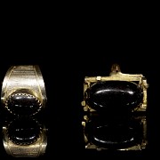 Two rings in yellow gold and black stones