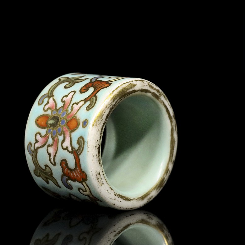 Porcelain enameled archer ring, 20th century