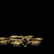 Gold bracelet with seven coins