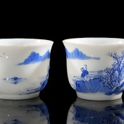 Pair of small porcelain ‘Landscape’ cups, Qing dynasty