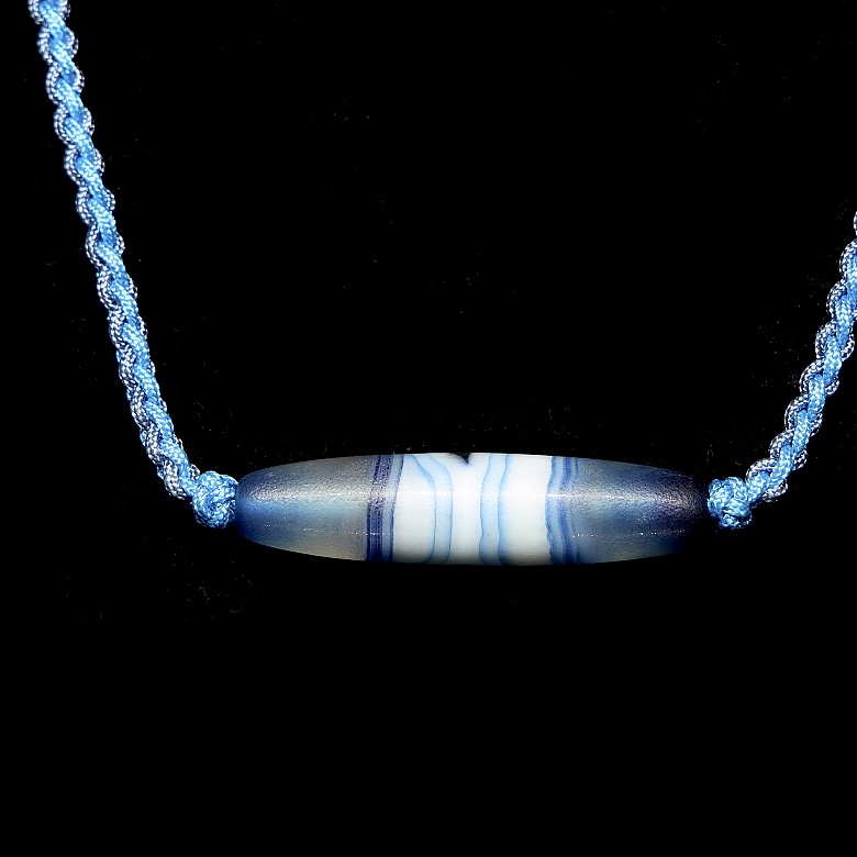 Blue and white agate ‘Dzi’ pendant, Tang dynasty