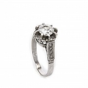 18k white gold solitaire ring with diamonds.