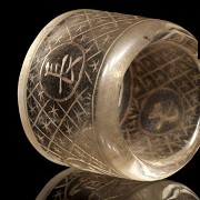 Carved quartz ring with characters, 20th century