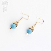 Earrings in 18k yellow gold and turquoise.