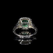 White gold ring with emerald and brilliants