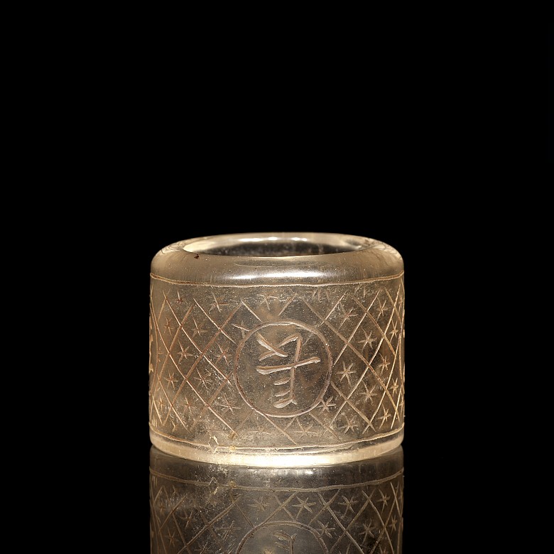 Carved quartz ring with characters, 20th century