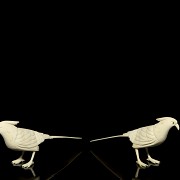 Pair of carved ivory birds, early 20th century.