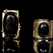 Two rings in yellow gold and black stones