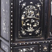 A Chinese lacquered cabinet with mother-of-pearl inlays, Qing dynasty.