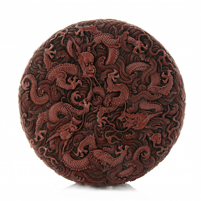 A carved cinnabar lacquer 