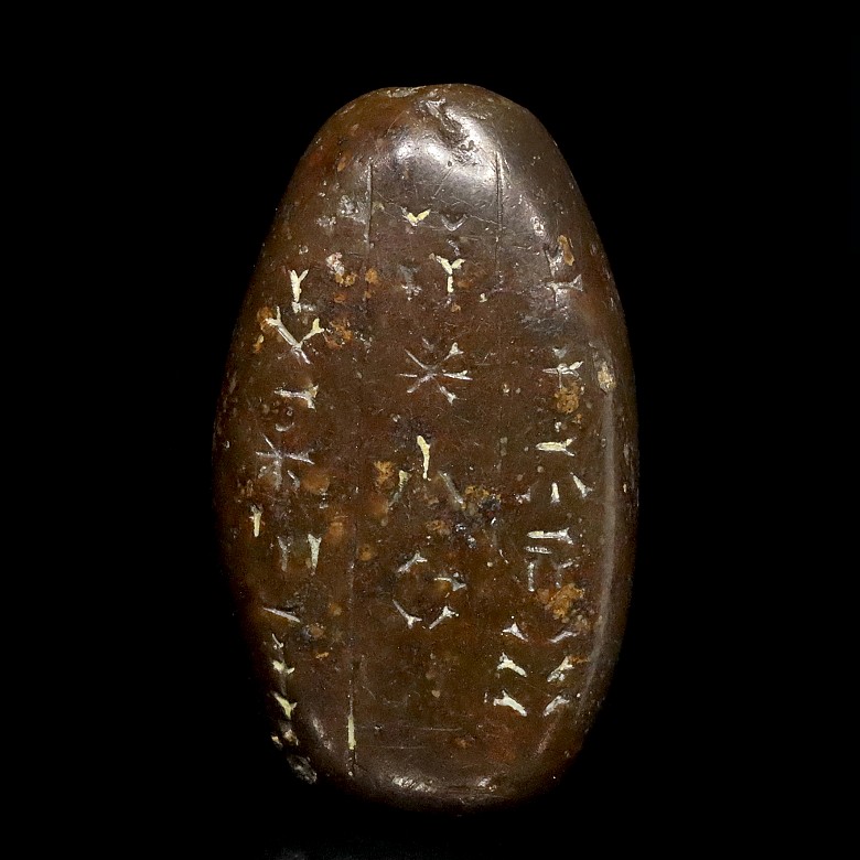 A small amulet with inscriptions, Sumerian or Assyrian.