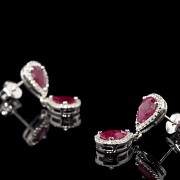 Earrings with movement in white gold with rubies and diamonds