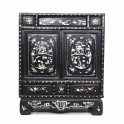 A Chinese lacquered cabinet with mother-of-pearl inlays, Qing dynasty.