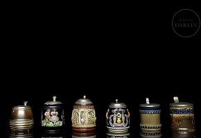 Six glazed ceramic beer steins, 20th century