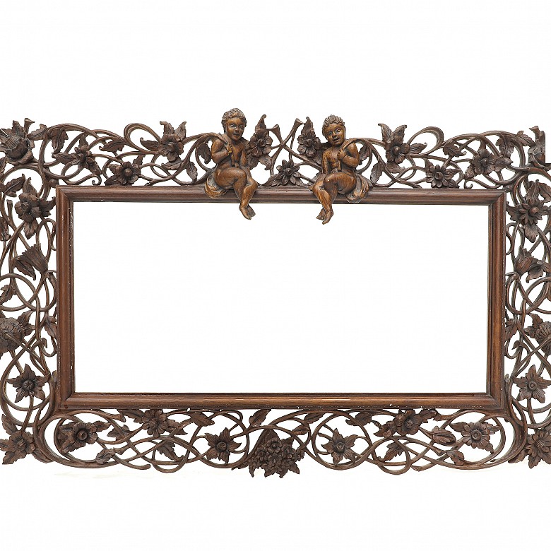 Vicente Andreu. Two fretworked wooden frames with cherubs, 20th century.