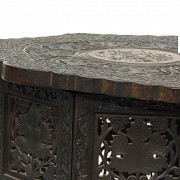 Carved wood table with a base, 20th century