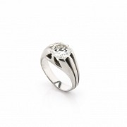 18k white gold solitaire ring with a diamond.