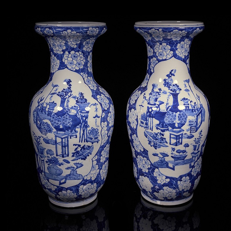 Pair of blue and white ‘Scenes and Plum Blossom’ vases, Qing Dynasty