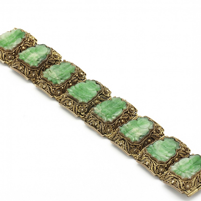 A Silver bracelet with jade plaques.