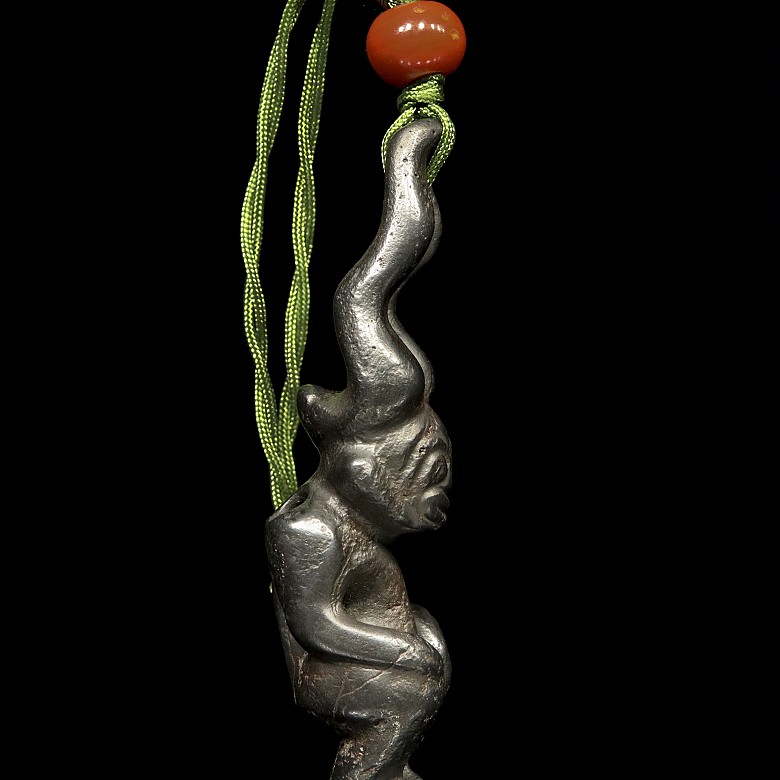 Carved stone pendant, 20th century