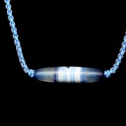 Blue and white agate ‘Dzi’ pendant, Tang dynasty