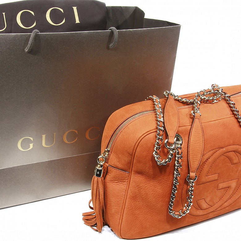 Gucci women's orange leather bag.