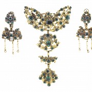 Fallera's adornments in gold metal and green stones