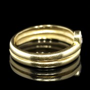 Doble anillo de oro amarillo 18 k con brillante