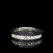 Half wedding ring in white gold with diamonds on rails