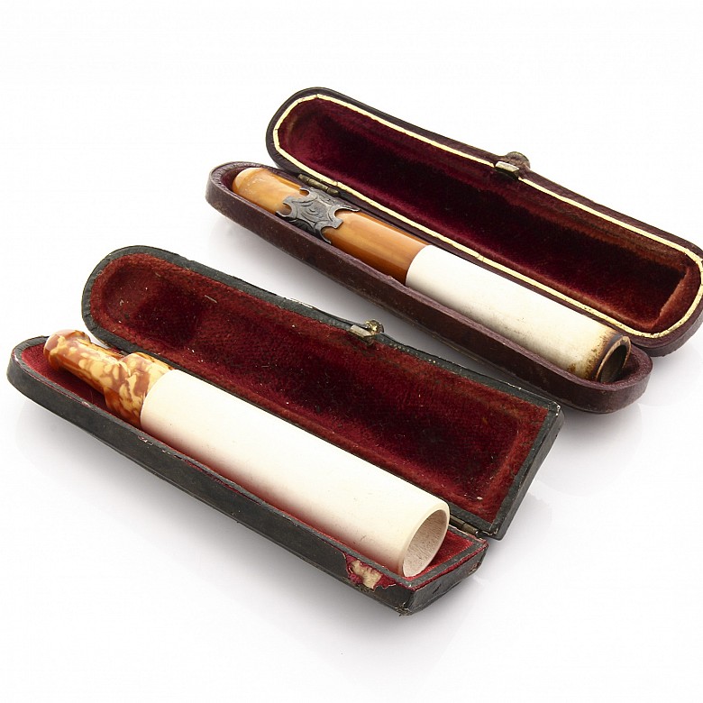 Two mouthpieces in meerschaum, amber and silver, 19th century