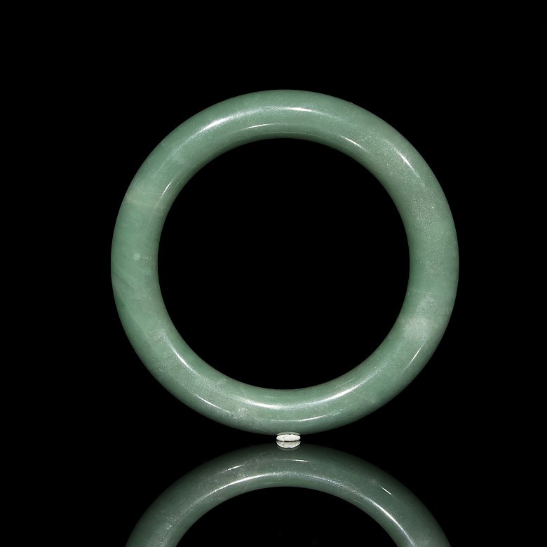 Carved green jadeite bangle, 20th century