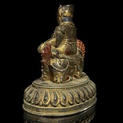 Sculpture of Buddha on lion.