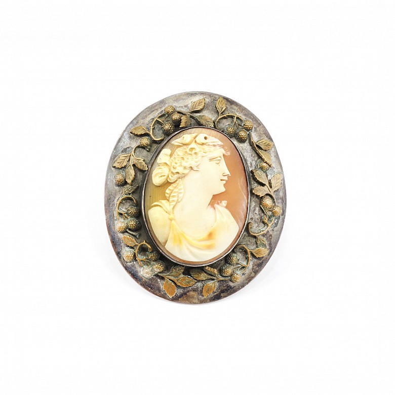 Silver cameo with agate center.