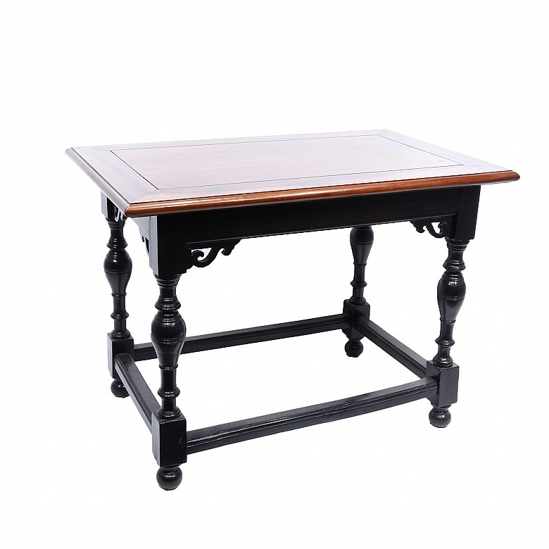 Low ebony table with turned legs.