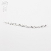 Link bracelet in white gold and 170 diamonds.