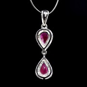 Pendant in 18 kt white gold with rubies and diamonds